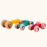 Tobe 3ple Stacking Cars wooden toys. Pink, blue and yellow coloured toy cars.