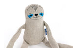 Close up of the Tobe hempions sloth toy on a white background