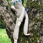 The Tobe The Hempions sloth toy placed on a tree. 