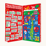 The open red coloured box of Tony's Chocolonely advent calendar on a cream background