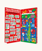 The open red coloured box of Tony's Chocolonely advent calendar on a cream background