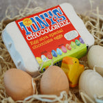 Tonys chocolonely egg-stra special fairtrade mini chocolate eggs in a basket full of straw