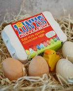 Tonys chocolonely egg-stra special fairtrade mini chocolate eggs in a basket full of straw