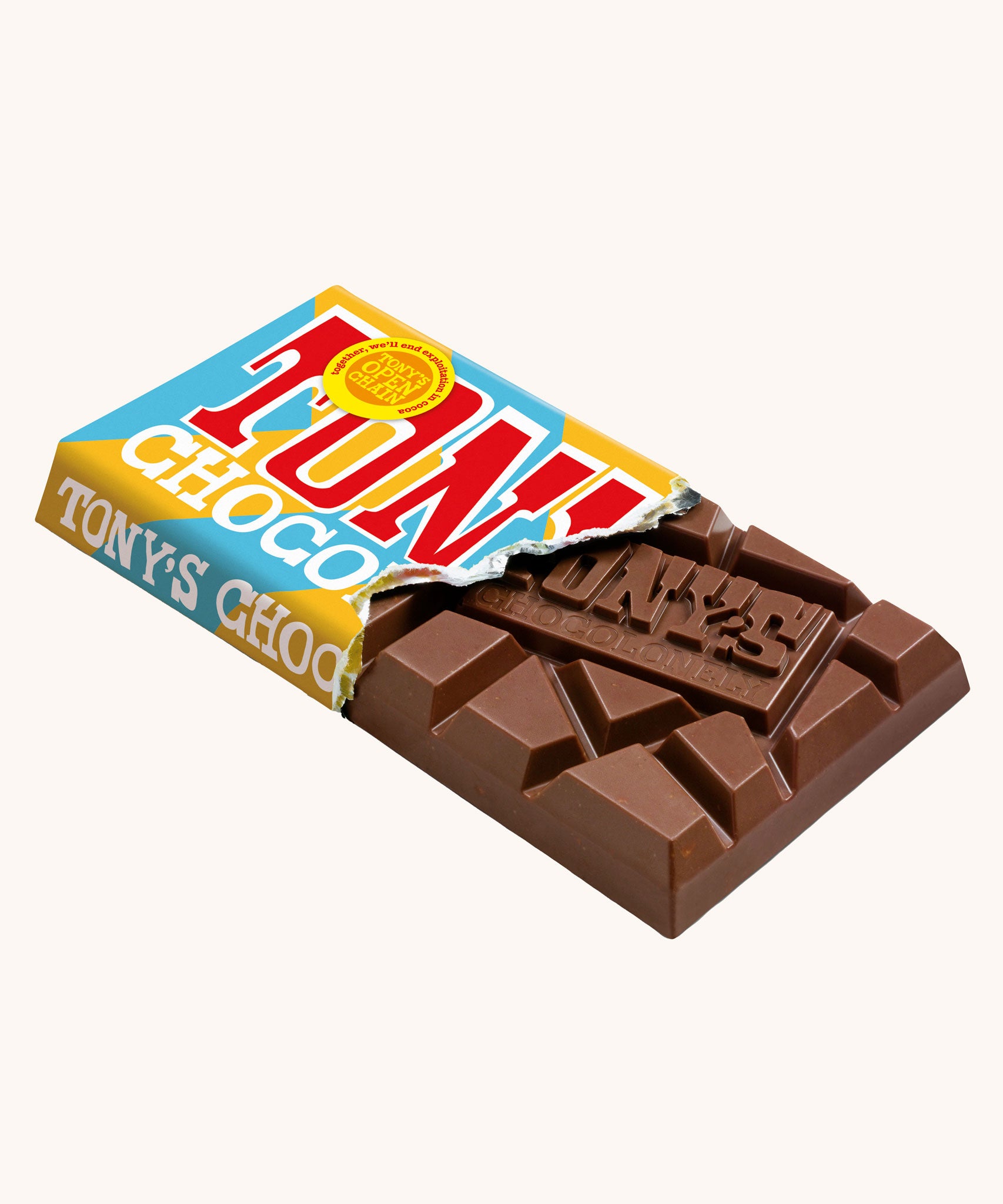 Tony's Chocolonely Rice Crispy Caramel Milk Chocolate Bar shown in it's paper packaging with the paper torn revealing the chocolate bar inside.. 