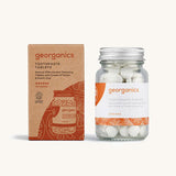 A jar of the Georganics orange toothpaste tablets with the box