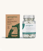 A jar of the Georganics spearmint toothpaste tablets with the box