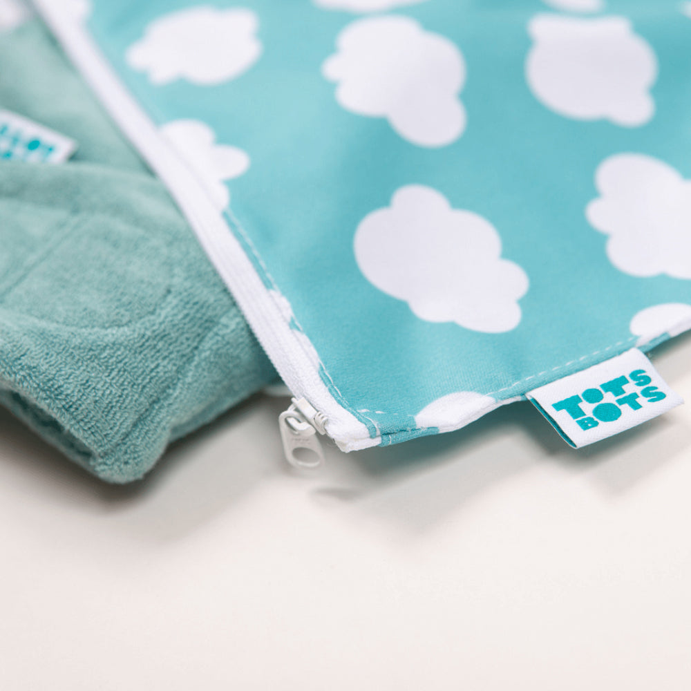 Close up of the label and zip opening on the Tots Bots wet bag with a bamboozle nappy inside