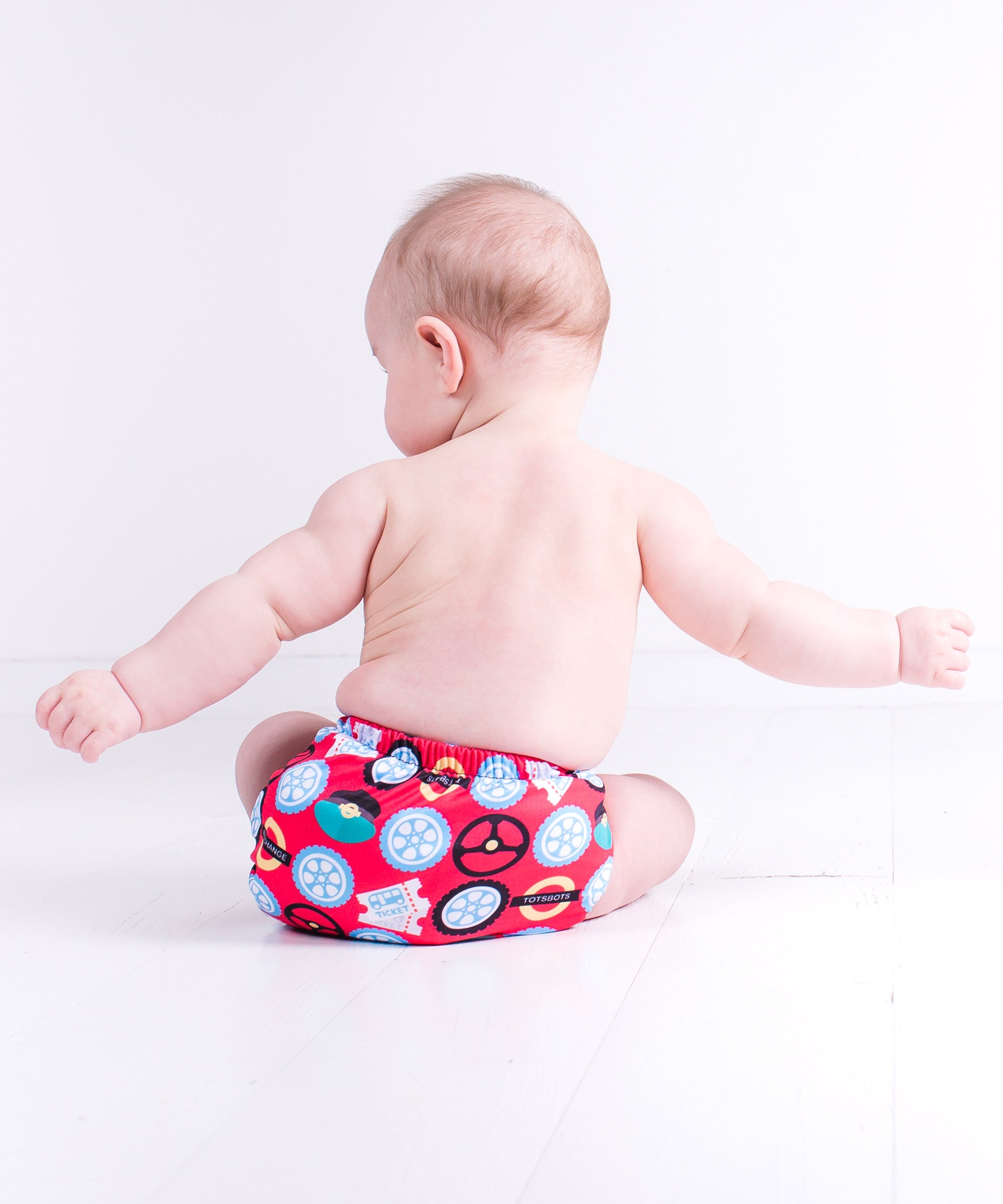 Totsbots wheels on the bus print reusable nappy wrap cover.