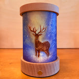 Toverlux lantern shade by Baukje Exler featuring translucent oil pastel artwork of quite early morning deer standing in a blue coloured forest backdrop. 