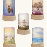 Set of 5 Toverlux Lantern Shades by Baukje Exler translucent oil pastel artworks of quite early mornings including 5 different scenes. A deer in a snow covered forest, grazing sheep, shepherd herding sheep, robin readbreasts amongt foliage and wave chaser sanderling birds on a wave. 