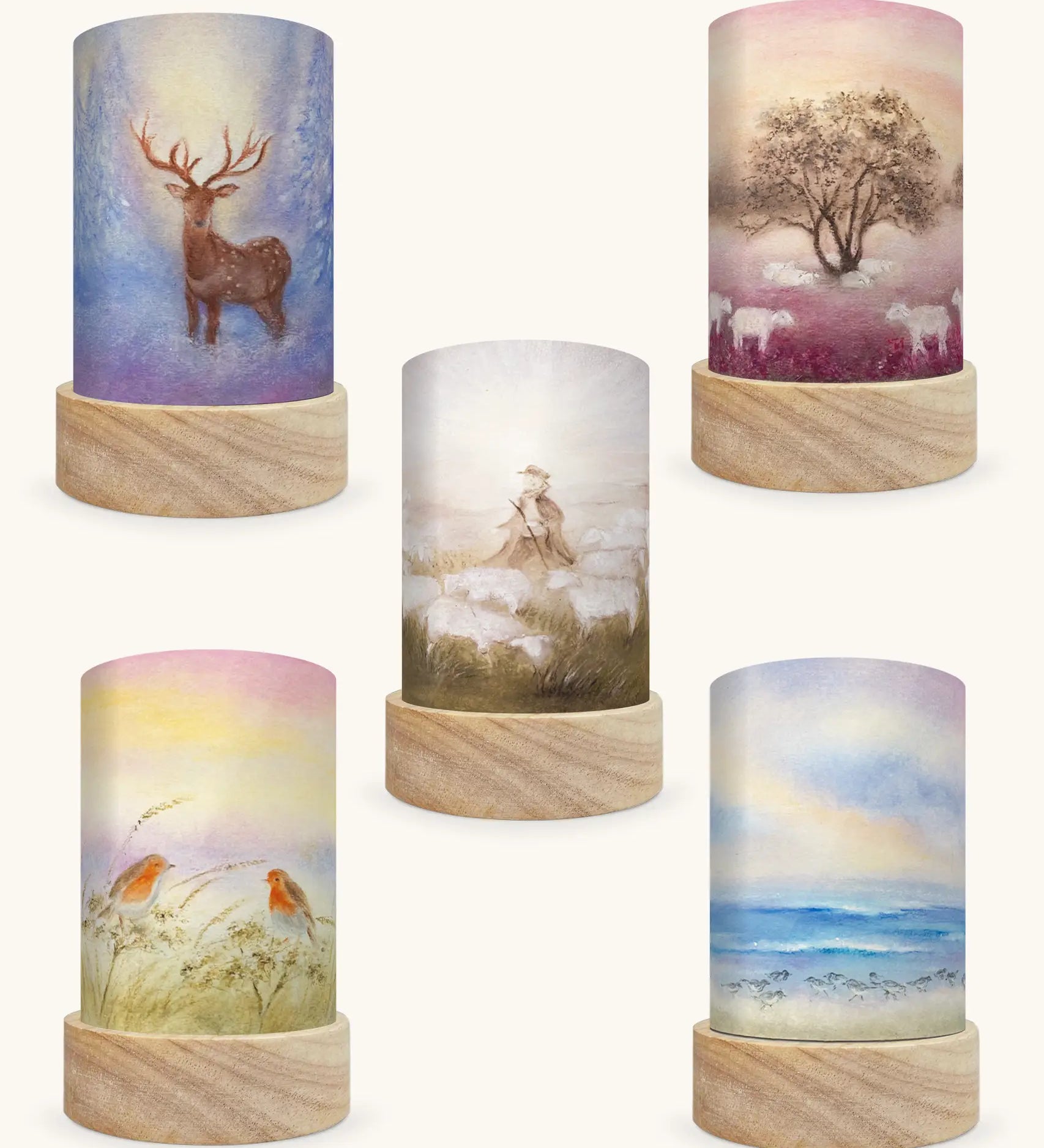 Set of 5 Toverlux Lantern Shades by Baukje Exler translucent oil pastel artworks of quite early mornings including 5 different scenes. A deer in a snow covered forest, grazing sheep, shepherd herding sheep, robin readbreasts amongt foliage and wave chaser sanderling birds on a wave. 