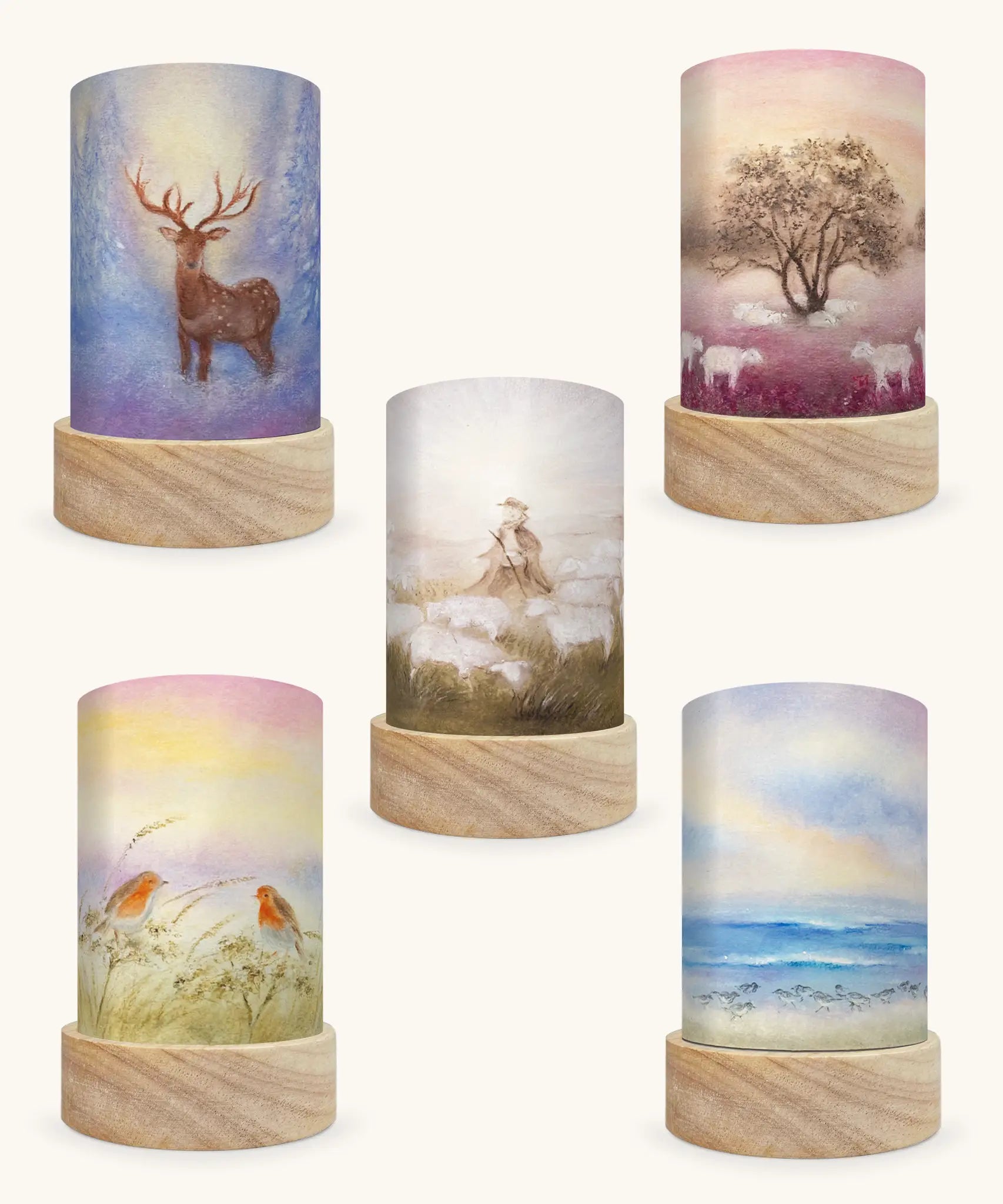 Set of 5 Toverlux Lantern Shades by Baukje Exler translucent oil pastel artworks of quite early mornings including 5 different scenes. A deer in a snow covered forest, grazing sheep, shepherd herding sheep, robin readbreasts amongt foliage and wave chaser sanderling birds on a wave. 