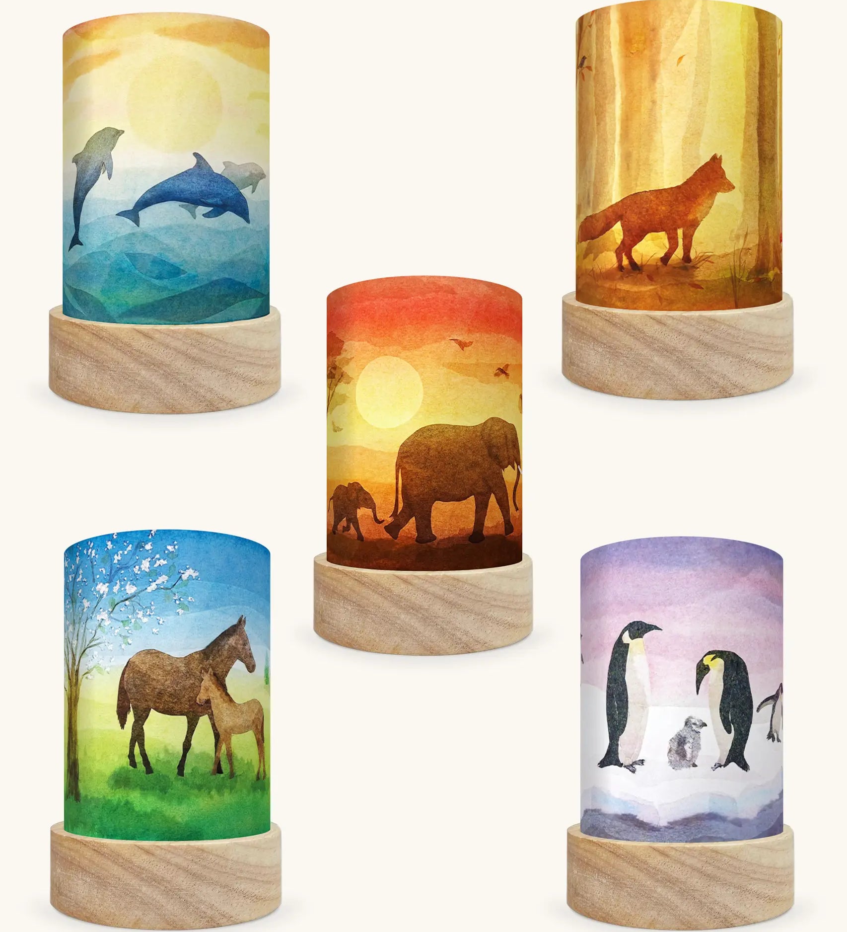 Set of 5 Toverlux Lantern Shades by Vogel Geluk, transparency artworks of fauna including 5 different animals on each. Dolphins, Fox in a forest, elephants walking in a sunset, Horses under a blossom tree and Penguins in snow. 
