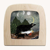 Toverlux Magic Lamp Silhouette Illustration Black Bears by Tijana Draws. The artwork features black bears walking through a forest accompanied by a lady with a lit candle. We have a range of Toverlux silhouettes, lamps and accessories available at Babipur.