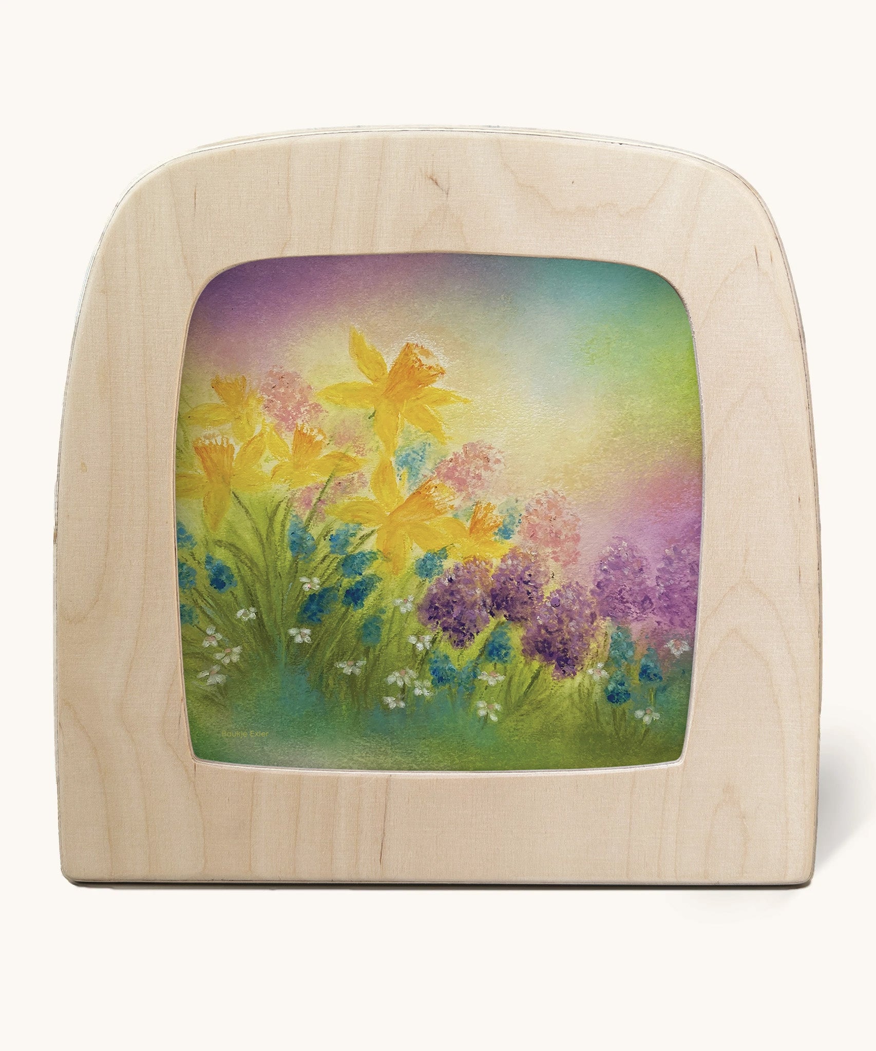 A Toverlux silhouette in the magic lamp, the illustration is of some purple flowers and daffodils with a dreamy purple and green gradient sky in the background.