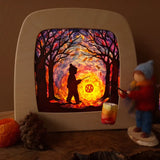 Toverlux DIY kit creation featuring a multicoloured sky with a silhouette of a child carrying a lantern through a forest in a parade displayed in a lit up magic lamp.