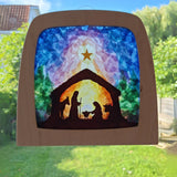 A Toverlux DIY Transparencies with  Winter nativity artwork shown in a wooden magic window frame.