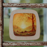 A close up of a Autumn woodland inspired Toverlux silhouette inside a 2 children looking at a silhouette inside a Toverlux Magic Window Frame available at Babipur. 