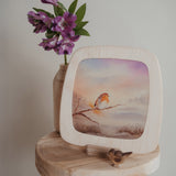A lovely display including a Toverlux Magic Window Frame with a robin silhouette on a base, both available at Babipur. 