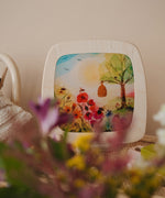 A spring bloom inspired display including a Toverlux Magic Window Frame with a matching silhouette  available at Babipur. 