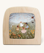 Spring dance Toverlux Magic Lamp Silhouette. Artwork By Robin-Pieterse. A delicate painting style illustration of 4 children dancing in a field surrounded by flowers and woodland animals
