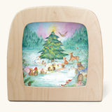 Toverlux Magic Lamp silhouette by Anne illustrates, yuletree grove artwork of a Christmas tree surrounded by forest animals and gnomes surrounded by festive foliage and snow topped toadstools.