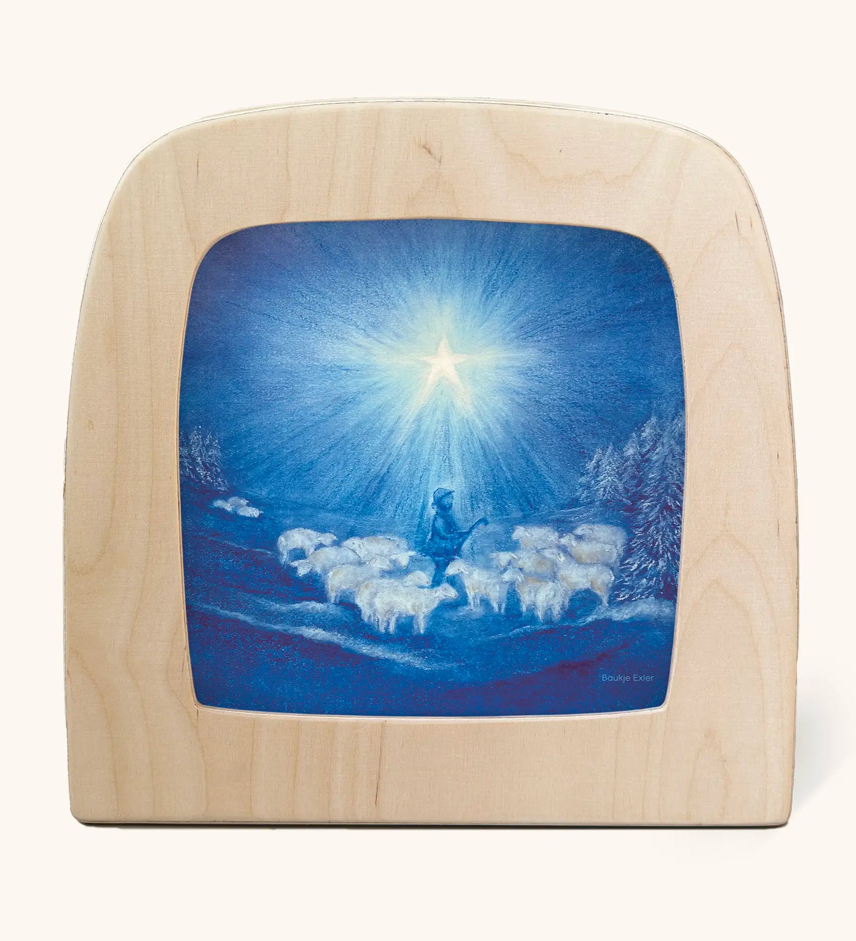 Toverlux guiding star winter silhouette by Baukje Exler. Blue illustration featuring a flock of sheep and a shepherd underneath a bright shining star. 