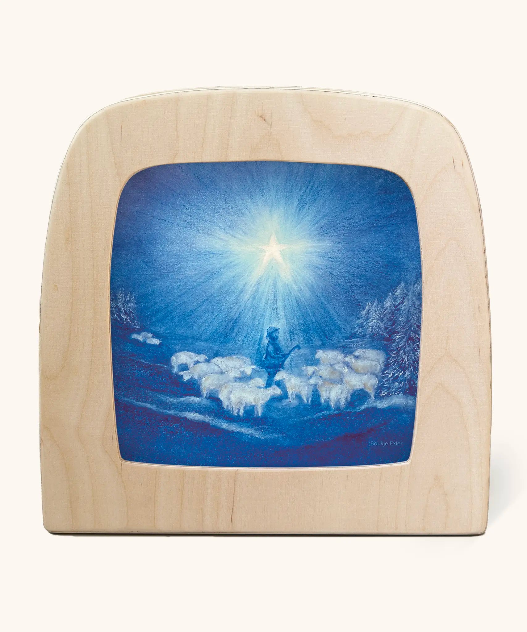 Toverlux guiding star winter silhouette by Baukje Exler. Blue illustration featuring a flock of sheep and a shepherd underneath a bright shining star. 