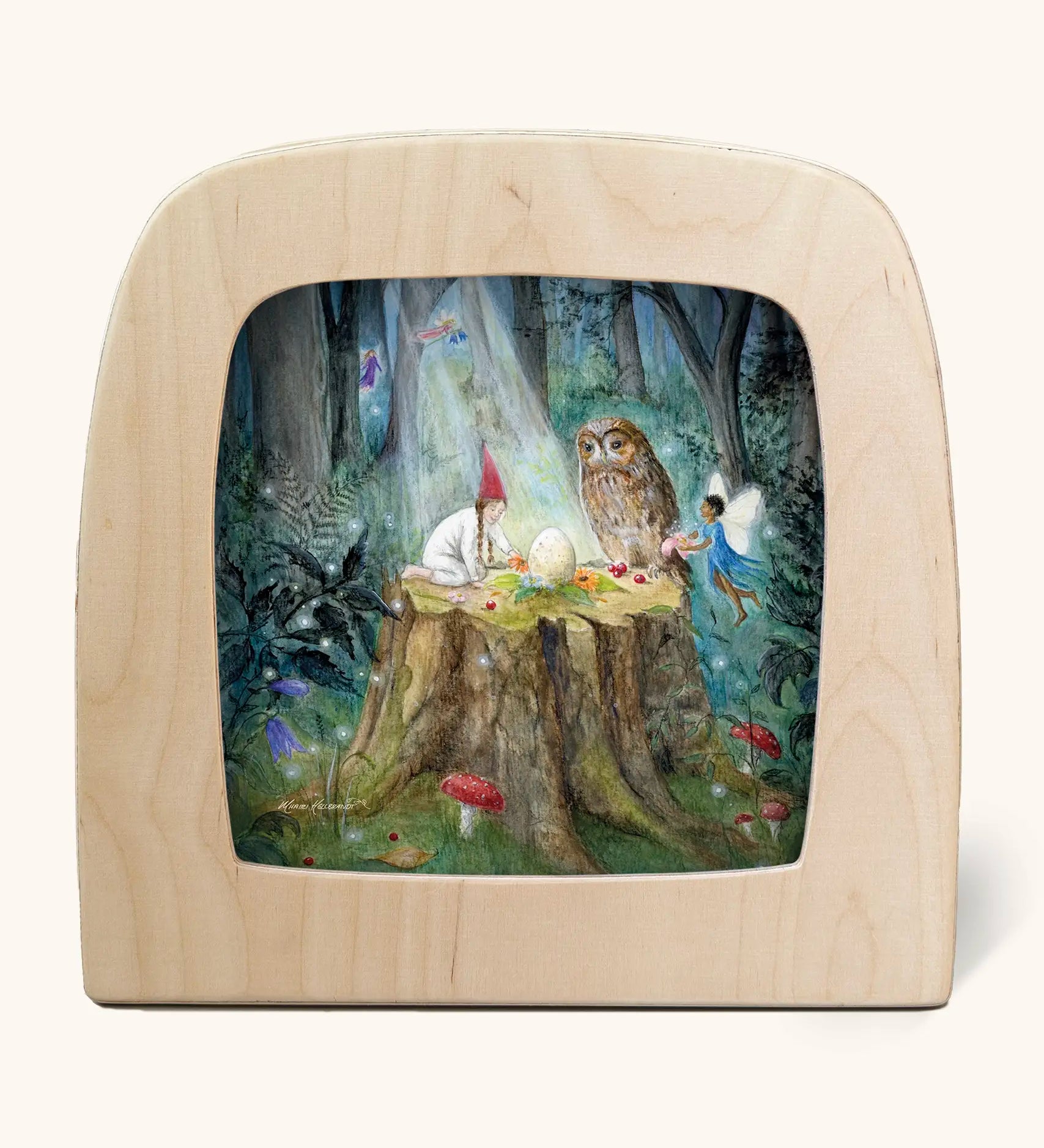 Toverlux silhouette artwork of a child, fairy and an owl taking part in a magical midsummer ritual forest scene on a tree stump with an egg placed in the middle. 