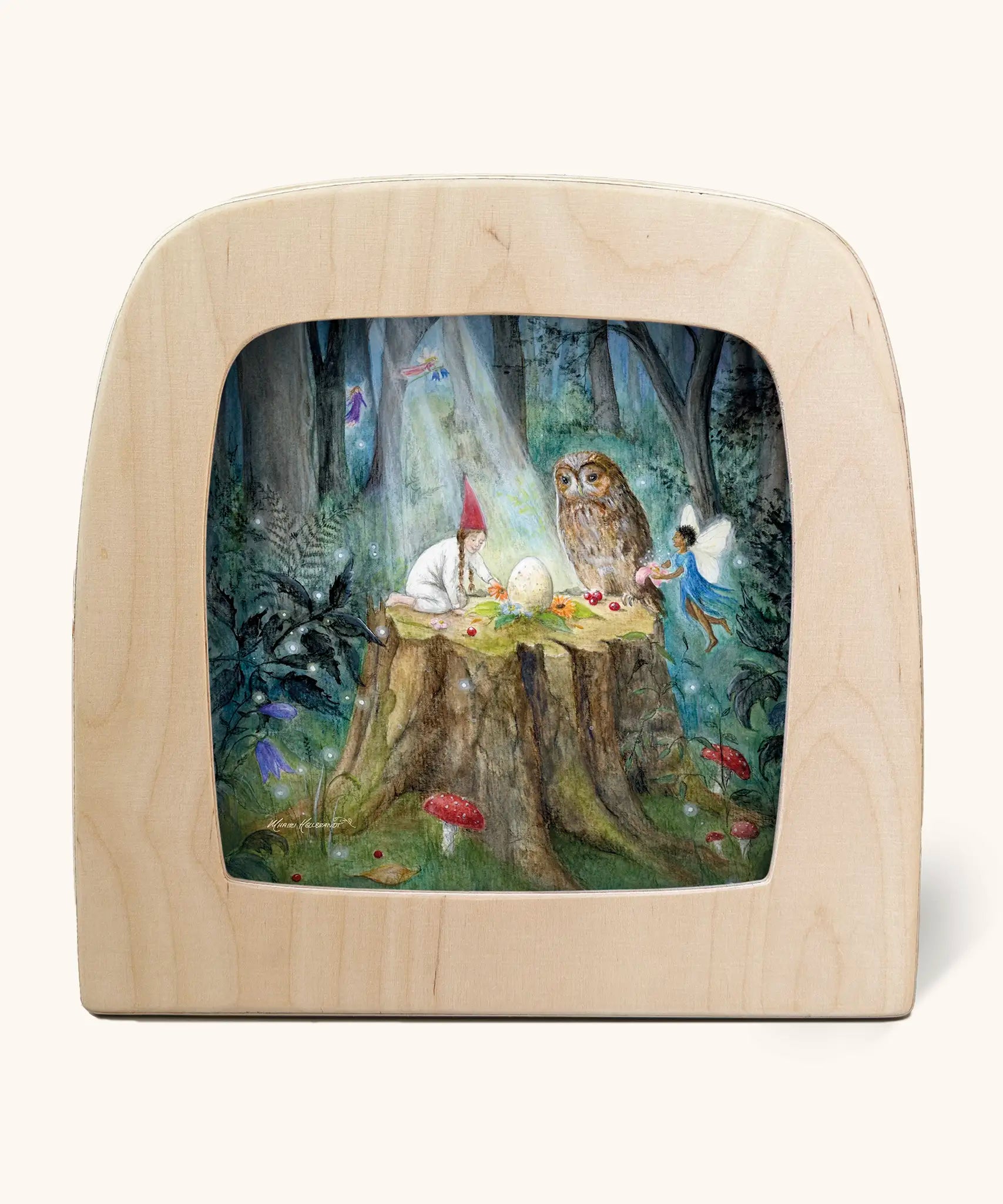 Toverlux silhouette artwork of a child, fairy and an owl taking part in a magical midsummer ritual forest scene on a tree stump with an egg placed in the middle. 