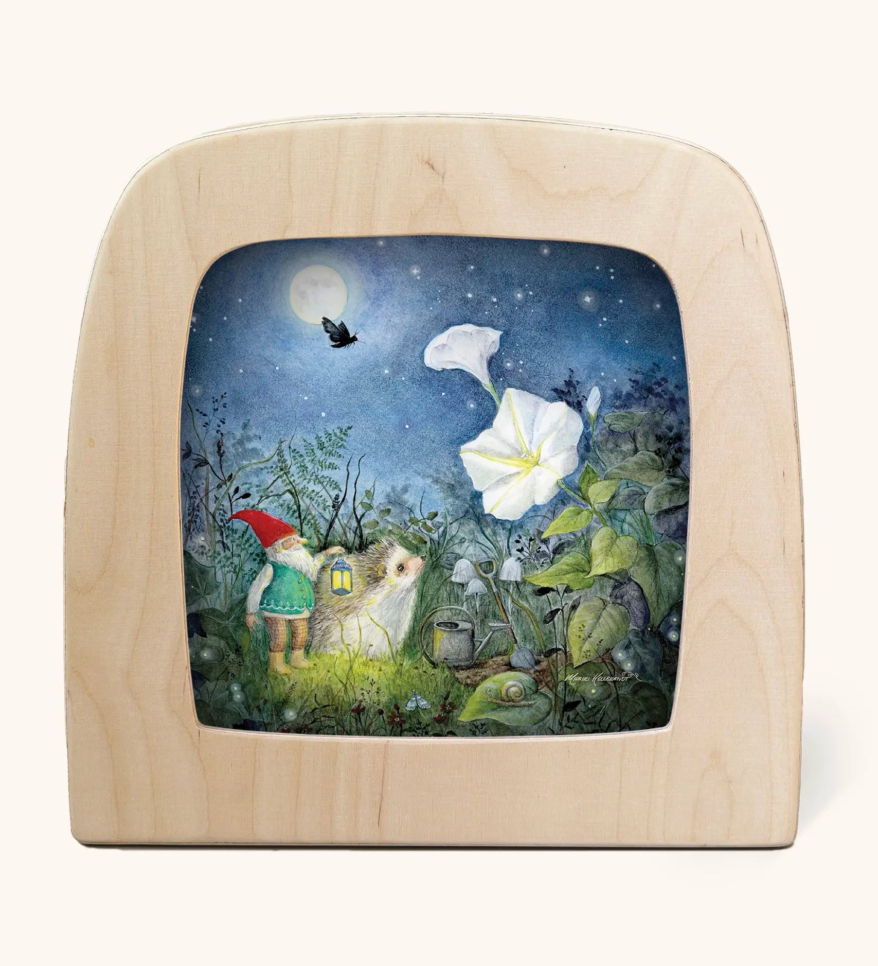 Toverlux silhouette artwork of a hedgehog and gnome looking up at a moonflower underneath the moonlight in a magical garden.
