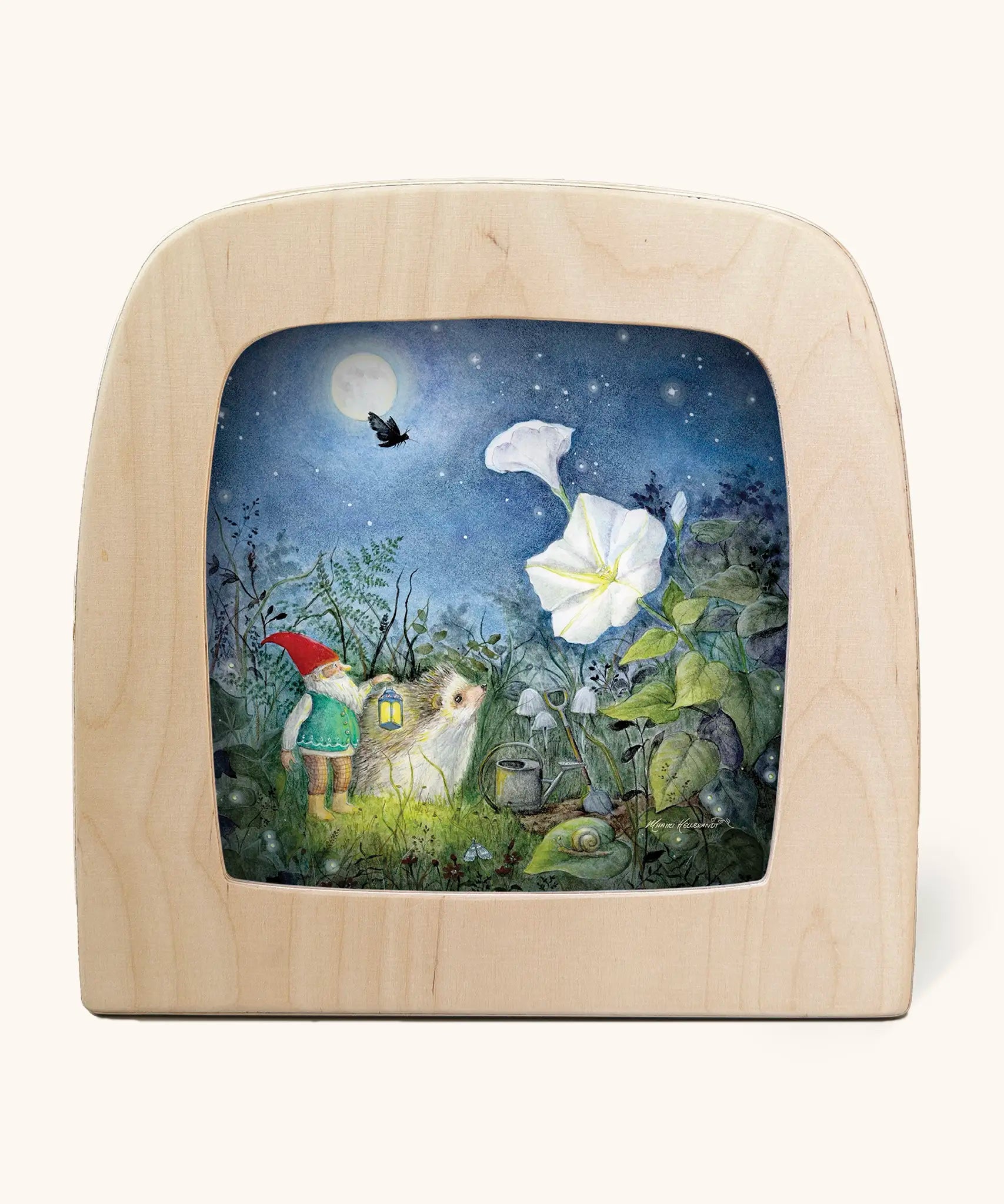 Toverlux silhouette artwork of a hedgehog and gnome looking up at a moonflower underneath the moonlight in a magical garden.