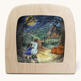 Toverlux Magic Lamp Silhouette - with a trick or treat Artwork By Eentje Van Margo. A moonlit spooky scene showing 2 children next to a house with pumpkins, a cat and bats flying outside. 