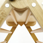 Close up of the Triclimb twr enclosure fixing on a natural triclimb kids climbing frame on a white background