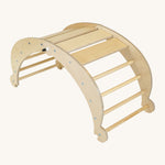 Triclimb wooden folding rocker Archi frame in natural with matching natural unpainted rungs. Features wide wooden slats on top for sitting and attachments on each end to hook onto a Triclimb pikler climbing frame