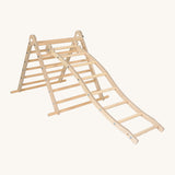Triclimb wooden wibli ladder with natural unpainted rungs hooked on a rung on the Triclimb pikler wooden climbing frame