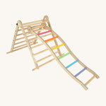 Triclimb wooden wibli ladder with pastel inspired coloured rungs hooked on a rung on the Triclimb pikler wooden climbing frame