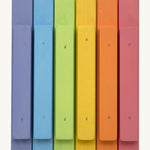 Bottom view of the Triclimb wooden pastel Miri sticks showing the extended base where the stick can slot on top of the Triclimb Miri slide