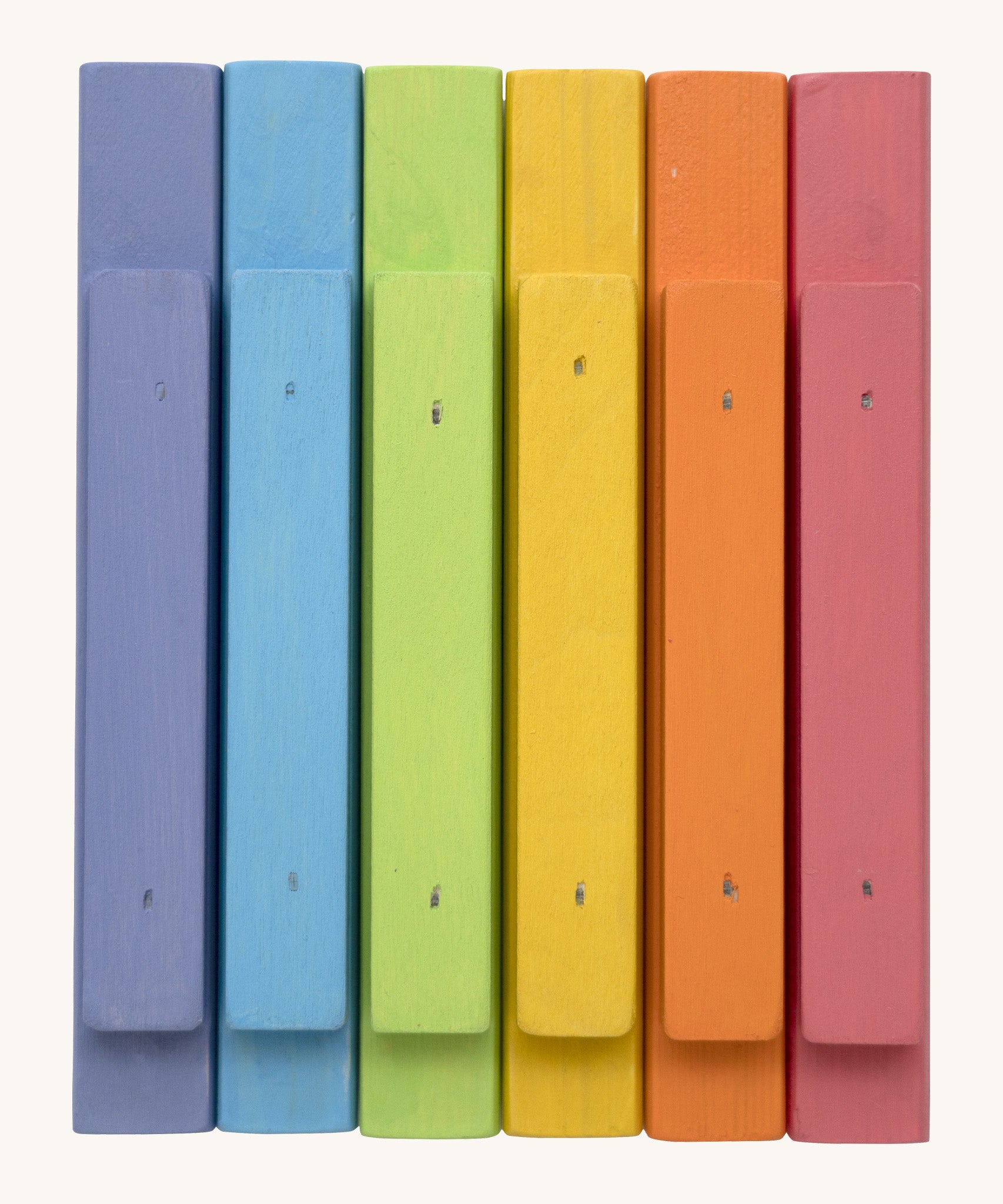 Bottom view of the Triclimb wooden pastel Miri sticks showing the extended base where the stick can slot on top of the Triclimb Miri slide