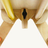 Close up of the wooden fixing on the Triclimb arben top deck and wooden steering wheel attachment on a white background