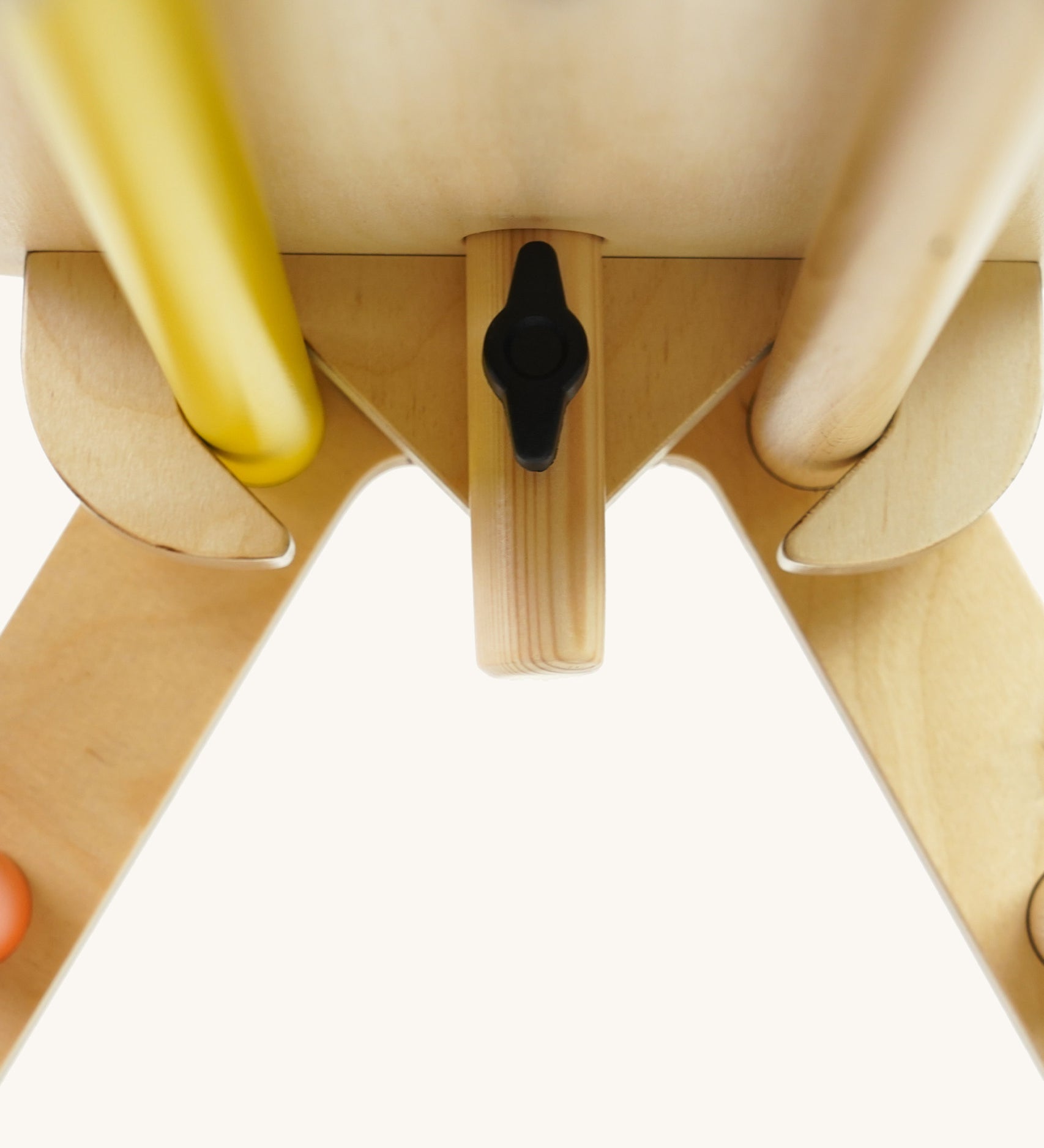 Close up of the wooden fixing on the Triclimb arben top deck and wooden steering wheel attachment on a white background