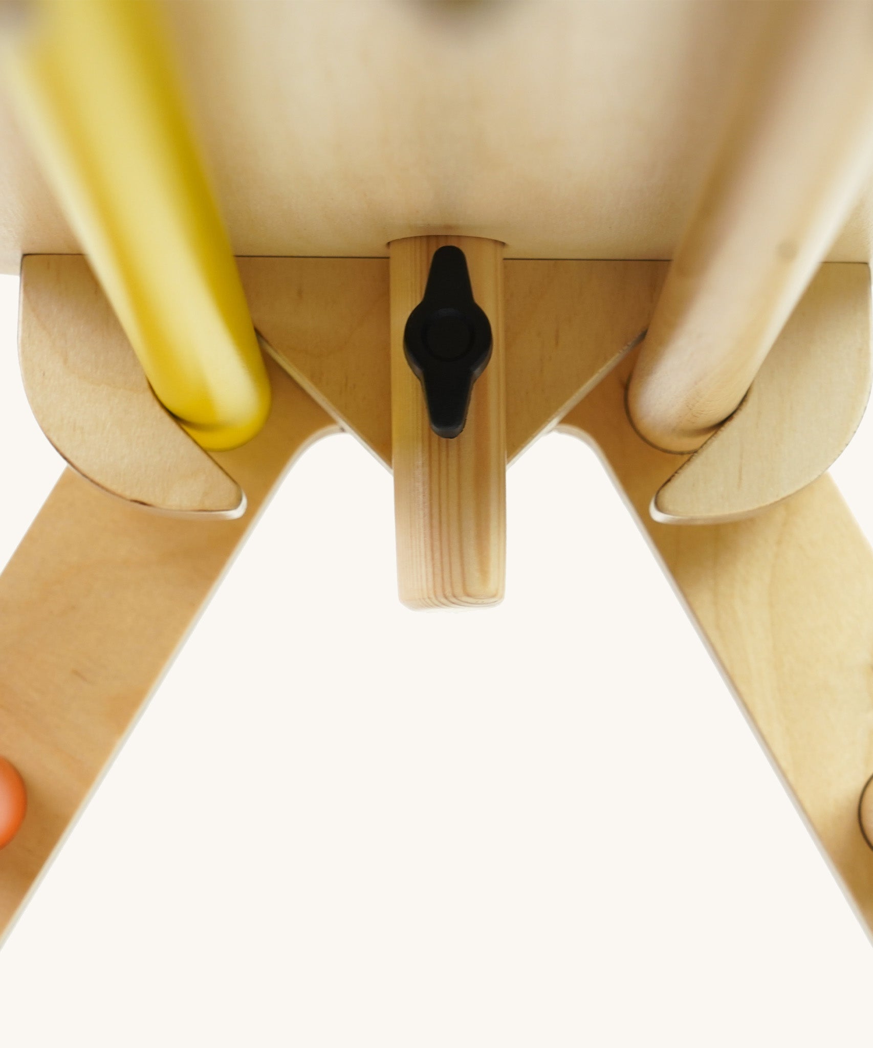 Close up of the wooden fixing on the Triclimb arben top deck and wooden steering wheel attachment on a white background