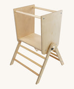 Triclimb wooden Arben twr attached on a pwt Triclimb pikler climbing frame that can be put aside a kitchen counter as a stepping stool 