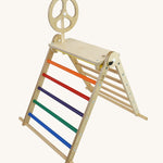 A Triclimb wooden Arben wheel attatched onto a Arben base that's hooked on the top rungs on the Triclimb pikler climbing frame. 