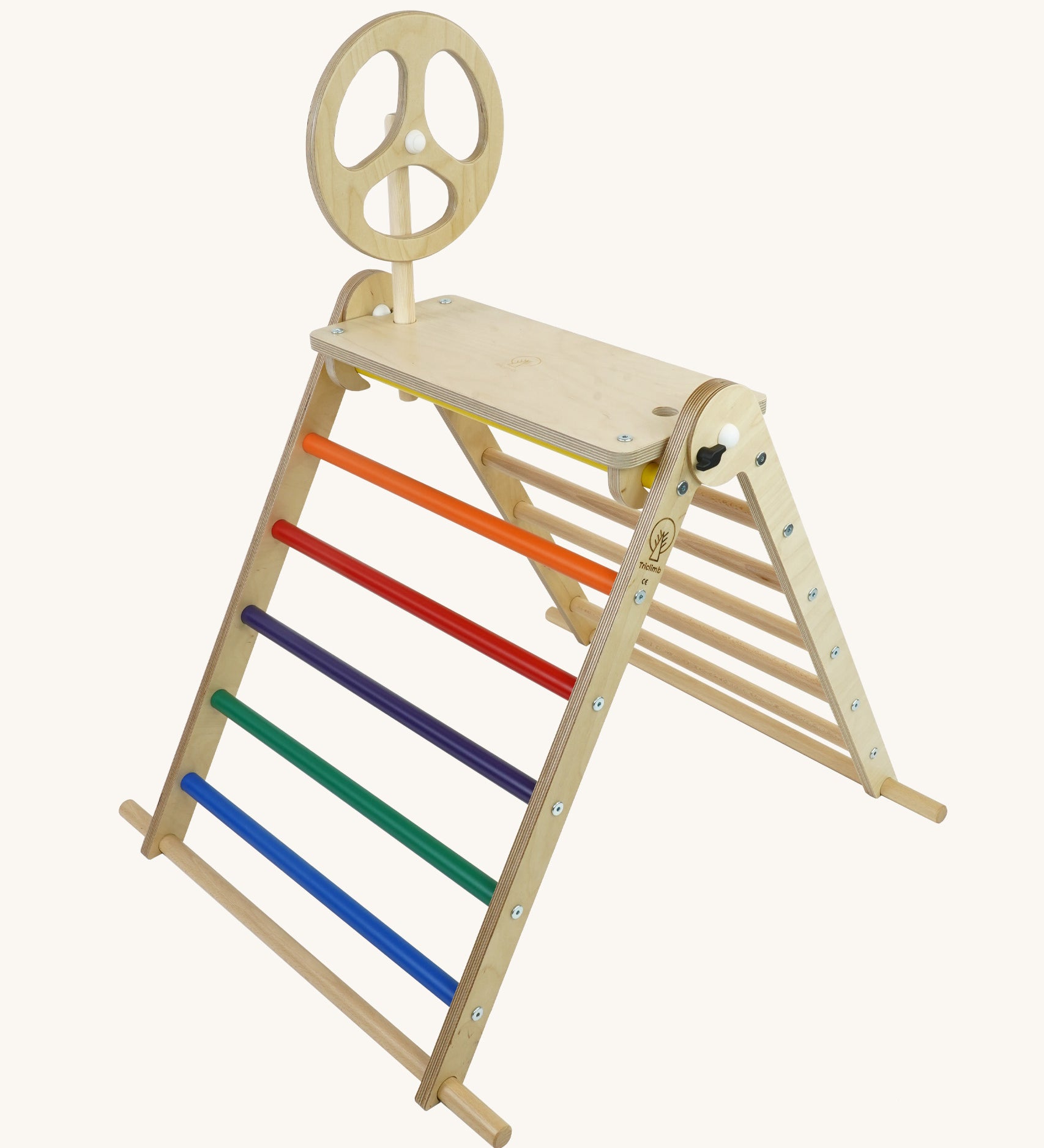 A Triclimb wooden Arben wheel attatched onto a Arben base that's hooked on the top rungs on the Triclimb pikler climbing frame. 