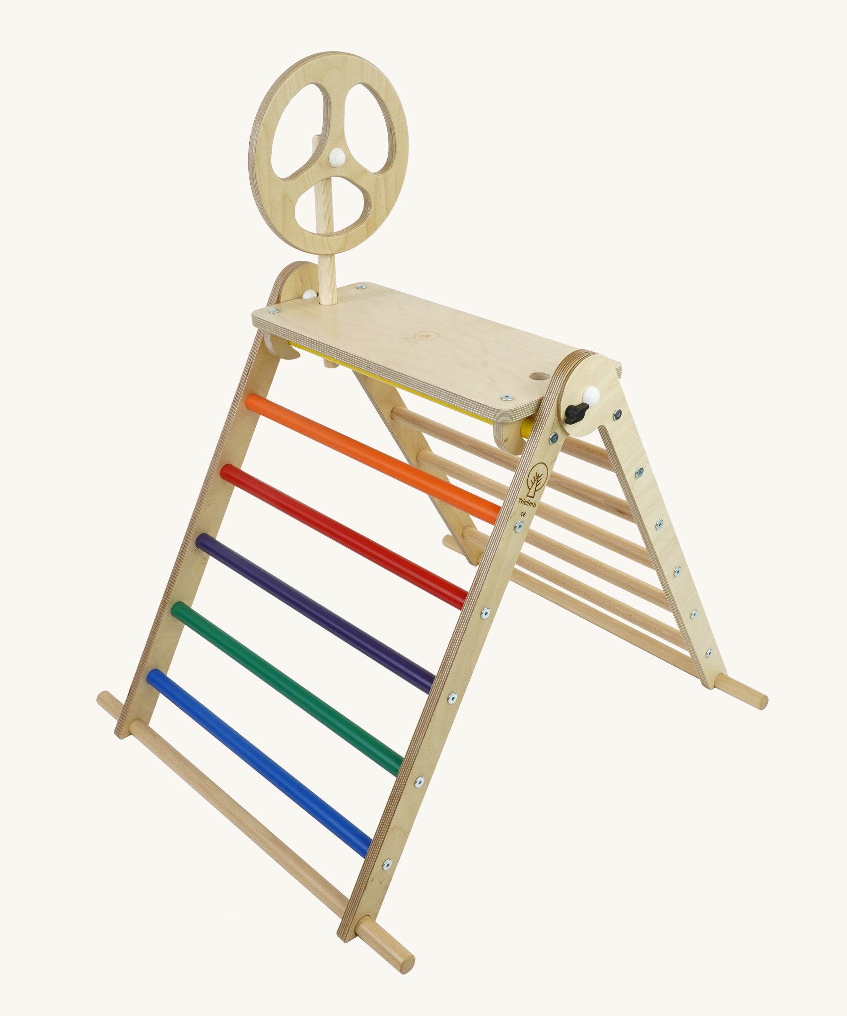 A Triclimb wooden Arben wheel attatched onto a Arben base that's hooked on the top rungs on the Triclimb pikler climbing frame. 