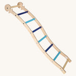 Triclimb wooden wibli ladder in blue features light and dark blue rungs with a Triclimb joint on one end of the ladder to hook onto a Triclimb wooden pikler climbing frame