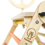 Close up of the Triclimb arben wooden steering wheel attachment on a white background