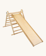 Triclimb wooden folding pikler climbing frame with natural unpainted rungs showing the second side Triclimb Miri slide hooked on a rung.