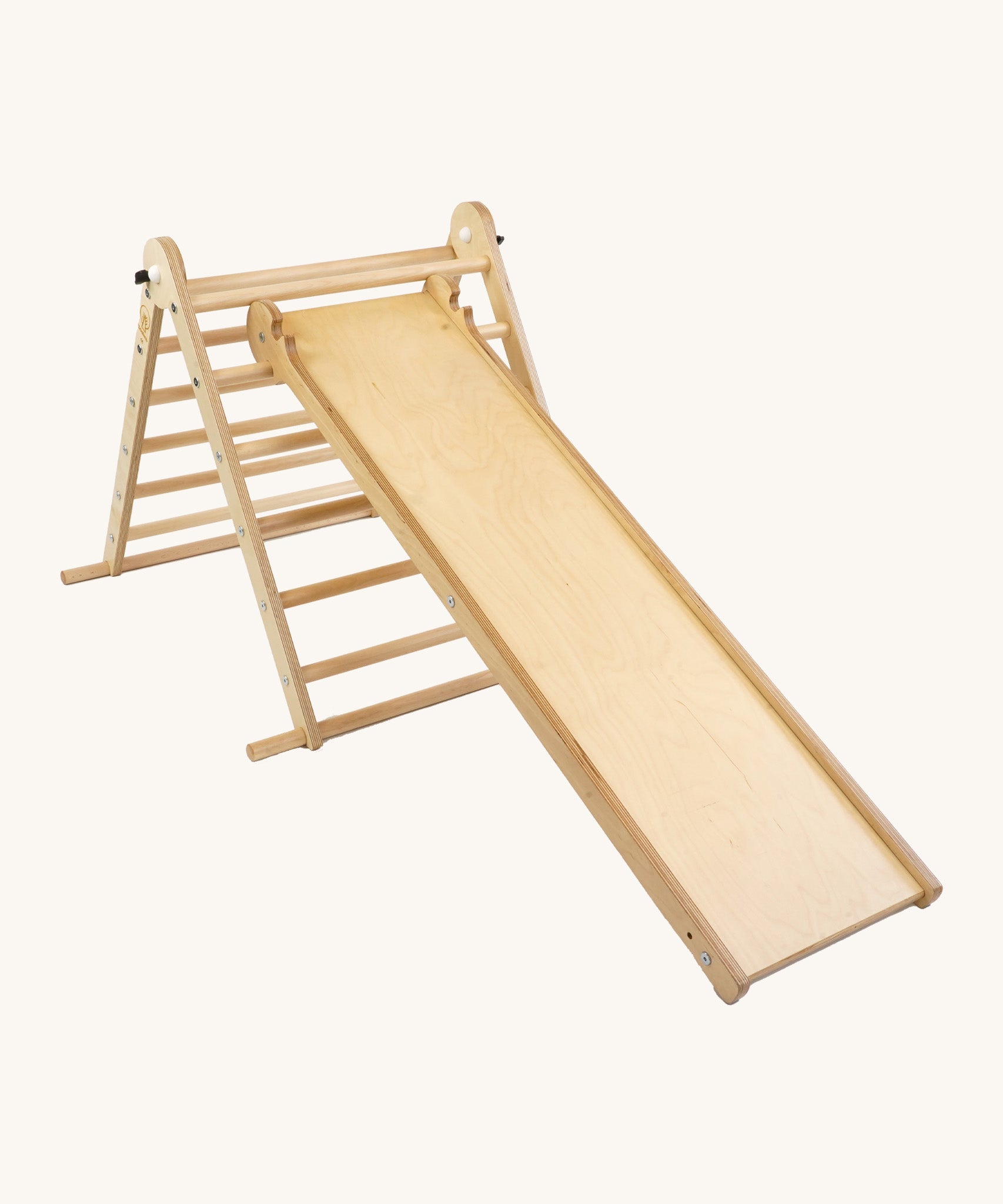 Triclimb wooden folding pikler climbing frame with natural unpainted rungs showing the second side Triclimb Miri slide hooked on a rung.